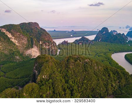 Aerial Top View Of Samet Nangshe And Tropical Green Forest Trees At Sunset With Andaman Sea In Phang