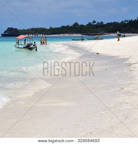 Kendwa, Tanzania - October 4, 2019: White Sandy Beach And Boat On A Coast In Kendwa Resort, Zanzibar