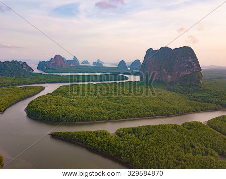 Aerial Top View Of Samet Nangshe And Tropical Green Forest Trees At Sunset With Andaman Sea In Phang