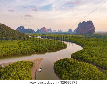 Aerial Top View Of Samet Nangshe And Tropical Green Forest Trees At Sunset With Andaman Sea In Phang