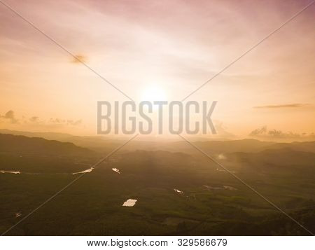 Aerial Top View Of Samet Nangshe And Tropical Green Forest Trees At Sunset With Andaman Sea In Phang