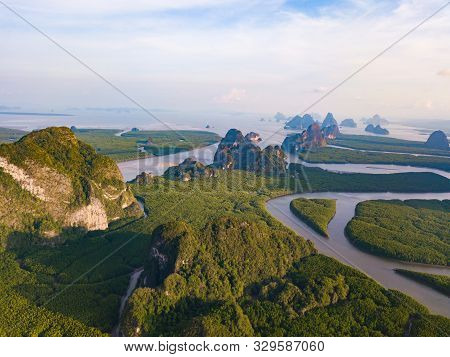 Aerial Top View Of Samet Nangshe And Tropical Green Forest Trees At Sunset With Andaman Sea In Phang