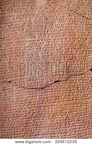 Ancient Assyrian Clay Tablet Document Covered By Cuneiform