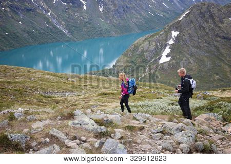 Jotunheimen, Norway - August 1, 2015: People Hike At Besseggen Trail In Jotunheimen National Park, N