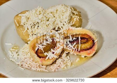Tasty Homemade Curd (cream Cheese) Dumpling Stuffed With Plums With Hard Curd, Sugar And Melted Butt