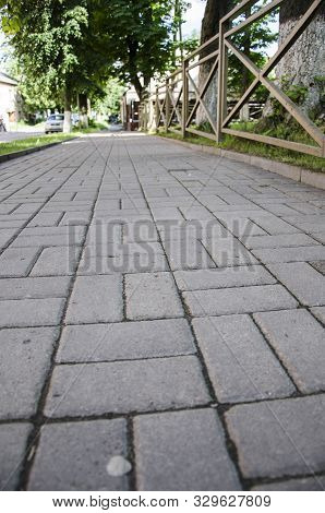 Ancient Pavement Leading Into The Distance With Vanishing Point As Ancient Background In Vintage Sty