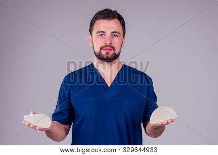 Plastic Surgeon Male Showing Before Modern Augmentation Implanty Studio White Background