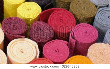 Background Of Many Rolls Of Felt Textile For Sale At Fabric Store
