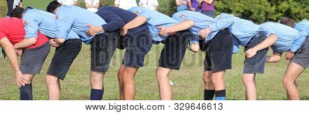 Many Boy With Scout Uniform Playing At Leapfrog Outdoor In Summer