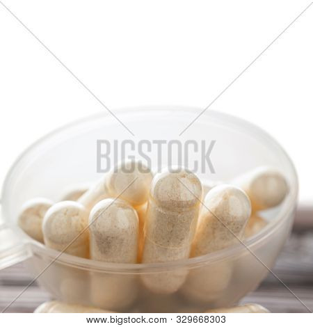 White Medical Capsules Of Glucosamine Chondroitin, Healthy Supplement Pills In The Plastic Spoon Iso