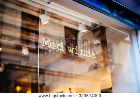 Barcelona, Spain - Nov 14, 2017: Logotype On The Glass Of Iconic Medietarnian Fashion Store Med Wind