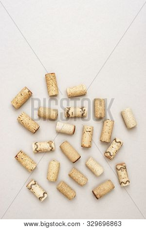 Minimal Trendy Concept With Corks From Wine Bottles On Lignt Paper Background With Copy Space. Flat 