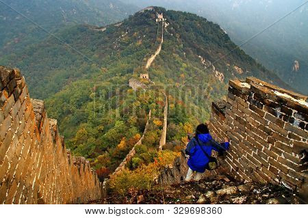 The Unrepaired Wild Great Wall Near Beijing And Hikers