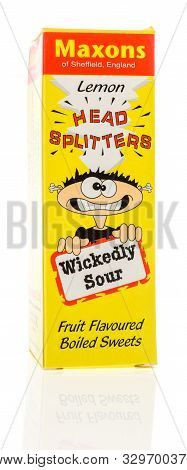 Winneconne, Wi - 10 October 2019: A Package Of Maxons Lemon Head Splitters Candy On An Isolated Back