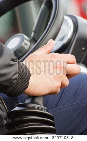 Man Operating Control Panel In Agricultural Or Industrial Machine, Part And Detail Of Vehicle
