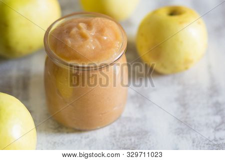 Apple Sauce In Glass Jar On The White Background