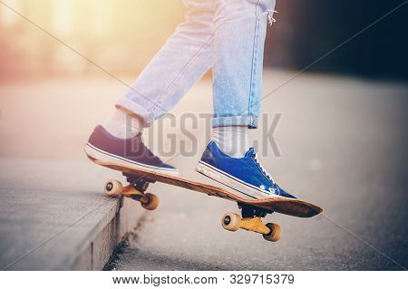 Skateboard Man In Shoes And Jeans Getting Ready To Jump Kickflip Olli From Steps