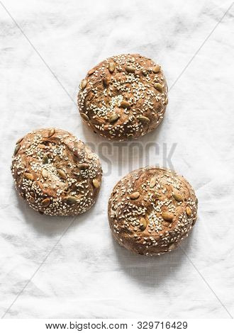 Multigrain Multiseed Fitness Buns On Light Background, Top View. Copy Space