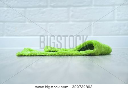 Microfiber Floorcloth, Green Closeup On A Gray Wooden Floor. Cleaning The House.