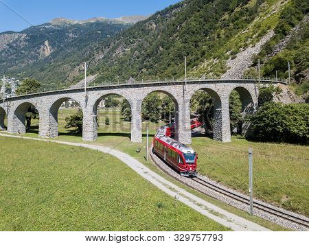 Brusio, Switzerland: 26 August 2018 - Bernina Express Is Going Through The Famous Circular Viaduct I