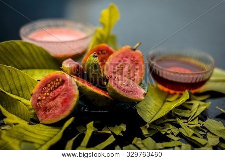 Skin Whitening Remedy/treatment On The Black Shiny Surface Consisting Of Guava Pulp And Honey. Also