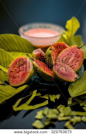 Skin Whitening Remedy/treatment On The Black Shiny Surface Consisting Of Guava Pulp And Honey. Also