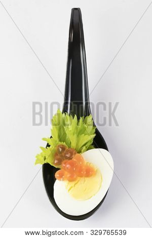 Molecular Cuisine Caviar Elements Shot Closeup Of A Plastic Buffet Table Spoon.