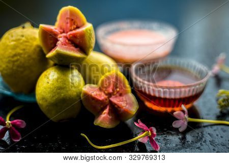 Skin Whitening Remedy/treatment On The Black Shiny Surface Consisting Of Guava Pulp And Honey. Also 