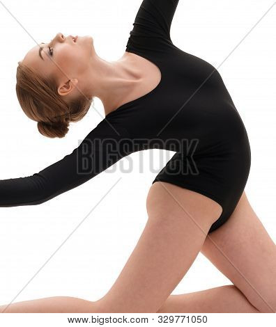 Young Slim Gymnast In Gracefull Pose Studio Shot