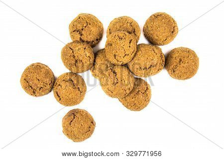 Bunch Of Scattered Pepernoten Cookies And Sweets From Above On White Background For Annual Sinterkla