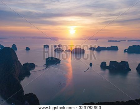Aerial Top View Of Samet Nangshe, Mountain Valley Hills, And Tropical Green Forest Trees At Sunset W