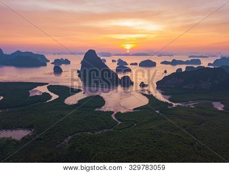 Aerial Top View Of Samet Nangshe, Mountain Valley Hills, And Tropical Green Forest Trees At Sunset W