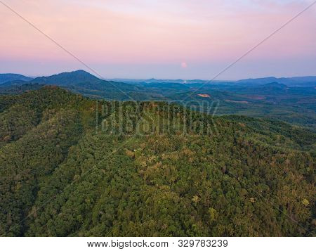 Aerial Top View Of Samet Nangshe, Mountain Valley Hills, And Tropical Green Forest Trees At Sunset W