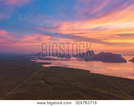 Aerial Top View Of Samet Nangshe, Mountain Valley Hills, And Tropical Green Forest Trees At Sunset W