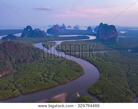 Aerial Top View Of Samet Nangshe, Mountain Valley Hills, And Tropical Green Forest Trees At Sunset W