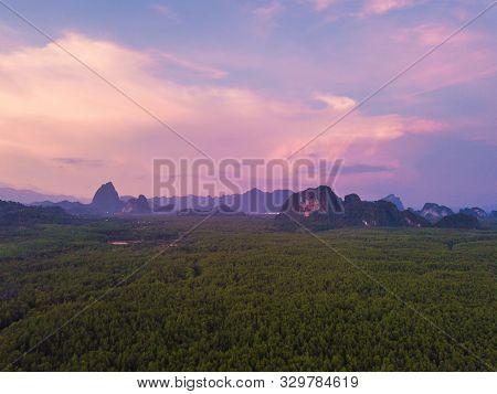 Aerial Top View Of Samet Nangshe, Mountain Valley Hills, And Tropical Green Forest Trees At Sunset W