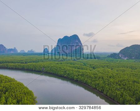 Aerial Top View Of Samet Nangshe, Mountain Valley Hills, And Tropical Green Forest Trees At Sunset W