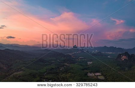 Aerial Top View Of Samet Nangshe, Mountain Valley Hills, And Tropical Green Forest Trees At Sunset W