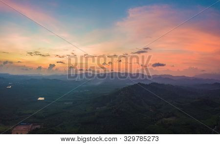 Aerial Top View Of Samet Nangshe, Mountain Valley Hills, And Tropical Green Forest Trees At Sunset W
