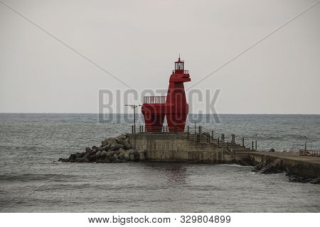 Iho Lighthouse At Iho Tewoo Beach In The North Of Jeju, South Korea