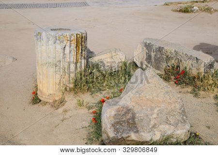 Elements Of Antique Ruins Of Limestone Blocks. The Destroyed Columns. Ruins Of The City Of Hierapoli