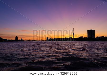 Rotterdam Harbor At Magenta Colored Sunset: View On The Euromast And Delfshaven Area Silhouette. Har