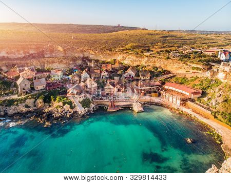 Village Popeye Bay Panorama Malta Sunset, Il-mellieha. Aerial Top View