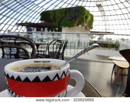 Reykjavik, Iceland, July 2019: Coffee On A Table In The Glass-domed Fine Dinging Restaurant Of The P