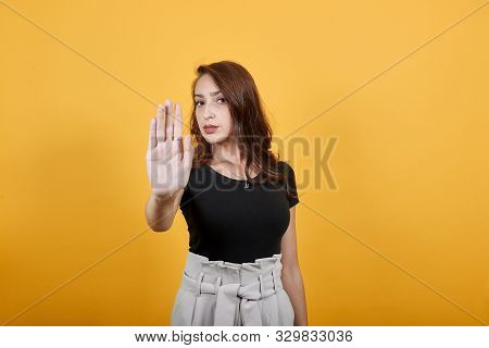 Charming Girl Stopping Someone As Something Unjust Is Happening. She Is An Educated Girl, And She Kn