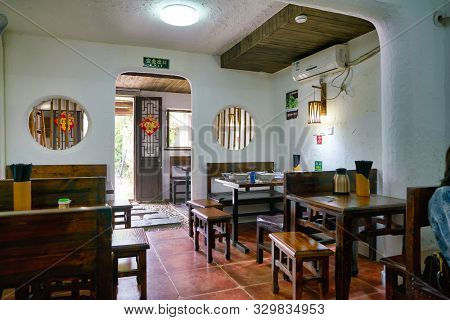 SHENZHEN, CHINA - CIRCA APRIL, 2019: interior shot of a restaurant at Gankeng Hakka Town in Shenzhen. Gankeng Hakka Town is a tourist attraction by OCT Group.