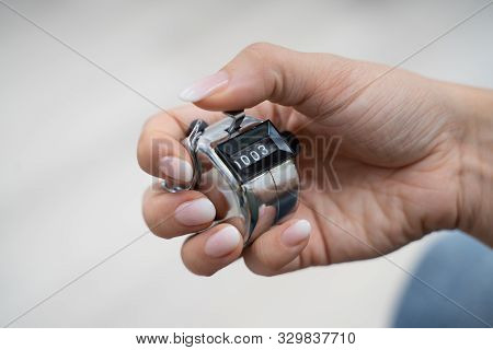 Close-up Photo Of Young Woman Using Headcounter