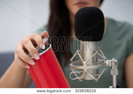Woman Opening Can On Microphone To Make Asmr Sounds