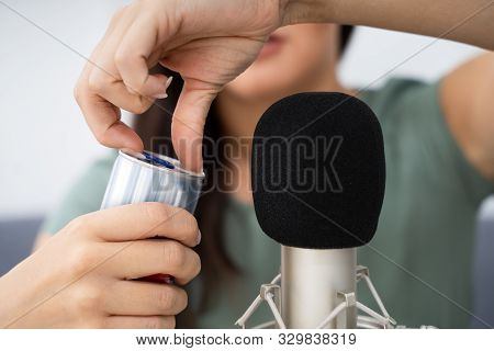 Woman Opening Can On Microphone To Make Asmr Sounds