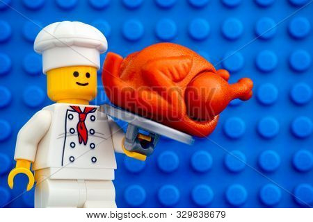 Tambov, Russian Federation - October 19, 2019 Lego Chef Minifigure With Turkey Against Blue Baseplat